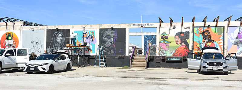 Artists work on the outside wall during Essex Paint Jam Volume 4 on Saturday, Jan. 6, 2024, at Essex Modern City in San Antonio. - photo by Joe Alexander