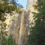 Bridal Veil Falls is brought to light by full sunlight by late afternoon. Even at the end of autumn when the water levels in Yosemite Falls are lower, it is a an impressive sight. – photo by Joe Alexander
