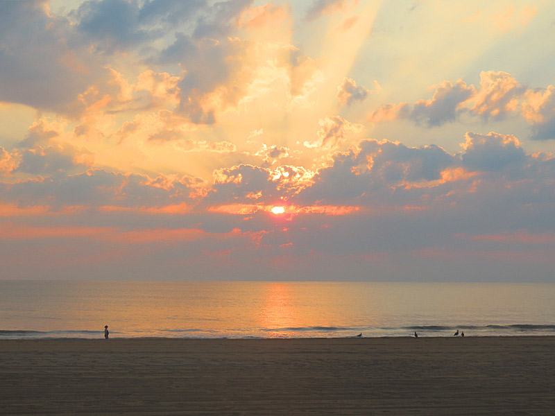 View from the boardwalk just after sunrise at Virginia Beach, Virginia. - photo by Joe Alexander