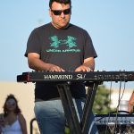 The Chris Cuevas Project played as the setting sun lit up Commons Park at the Rim on San Antonio’s north side on Wednesday, Aug. 2, 2023. – photo by Joe Alexander