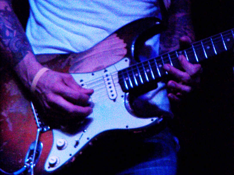 Eric Tessmer and his well worn Stratocaster at Sam’s Burger Joint on Saturday, July 27, 2013. - photo by Joe Alexander