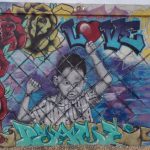 One of the “Love Fights Back” murals at Pr1mitive Ink tattoo shop in Glendale, Arizona.
