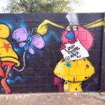 One of the “Love Fights Back” murals at Pr1mitive Ink tattoo shop in Glendale, Arizona.