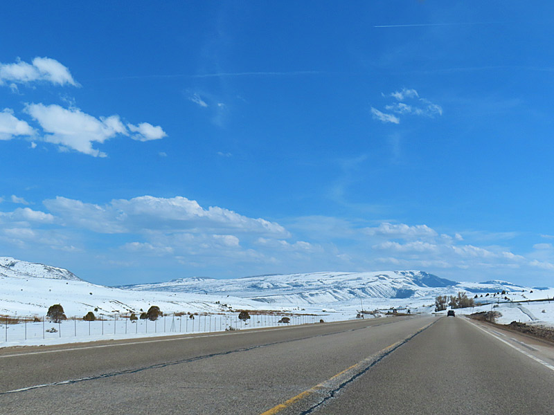Snow in the mountains along Highway 6. Driving from Salt Lake City to Moab in southern Utah. - photo by Joe Alexander