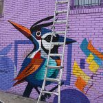 Mural in progress at Viva Fiesta Paint Jam facing Guadalupe Street at South Flores Street.