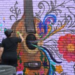 Mural in progress at Viva Fiesta Paint Jam facing Guadalupe Street at South Flores Street.