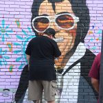 Mural in progress at Viva Fiesta Paint Jam facing Guadalupe Street at South Flores Street.