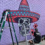 Mural in progress at Viva Fiesta Paint Jam facing Guadalupe Street at South Flores Street.