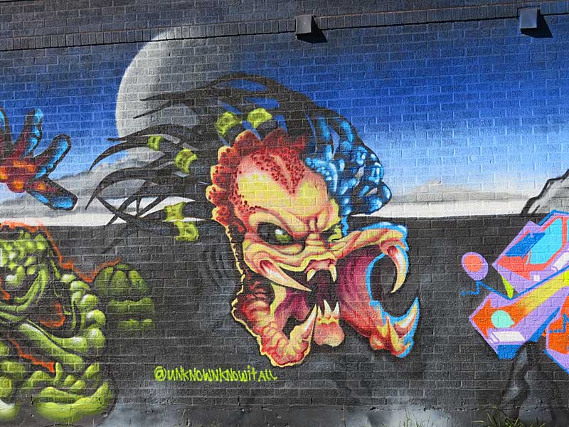 Mural by unknownknowitall on Hoefgen Street a few blocks south of the Alamodome.