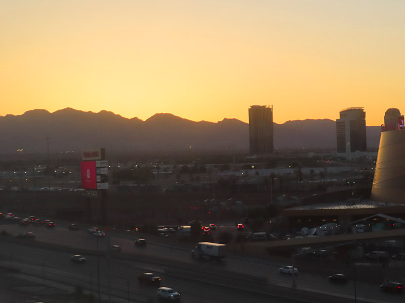 Off-strip hotels and the hills of Red Rock Canyon at sunset west of Las Vegas Boulevard. - photo by Joe Alexander