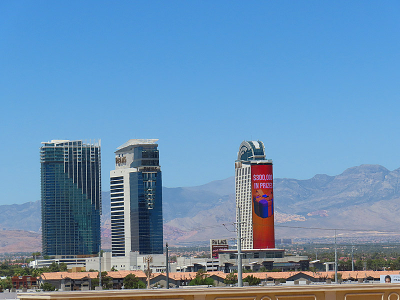 Off-strip hotels and the hills of Red Rock Canyon west of Las Vegas Boulevard. - photo by Joe Alexander