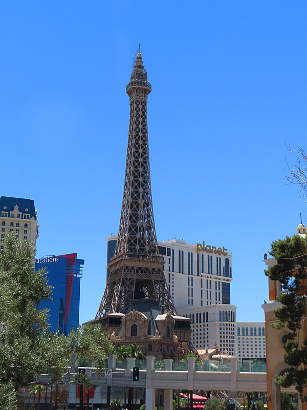 The Eiffel Tower of the Paris Casino next door to the Planet Hollywood, looking east from the Bellagio. - photo by Joe Alexander