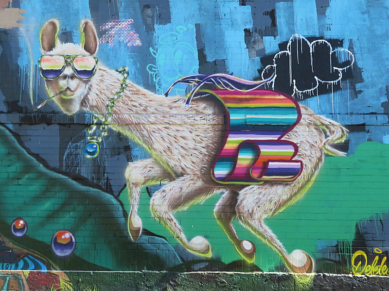 My all-time favorite artwork on Hoefgen Street was from from deletedtx. Alas, it is no longer there. This is part of a block-long street mural on Hoefgen Street just south of Carolina a few blocks from the Alamodome in downtown San Antonio.