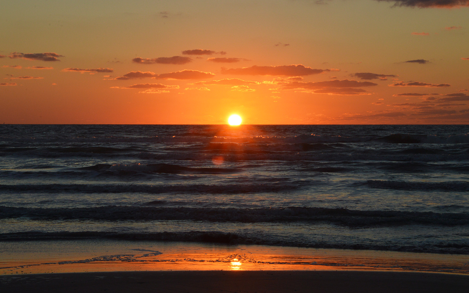 Sunrise on an October morning near Beach Marker 215 at North Padre Island's Whitecap Beach in Corpus Christi, Texas. - photo by Joe Alexander